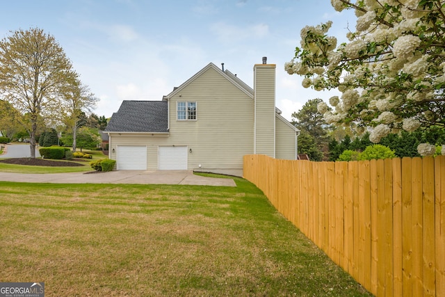 2635 Stonehill Dr, Cumming, GA 30041 - view of side of property featuring a lawn, roof with shingles, fence, a chimney, and driveway