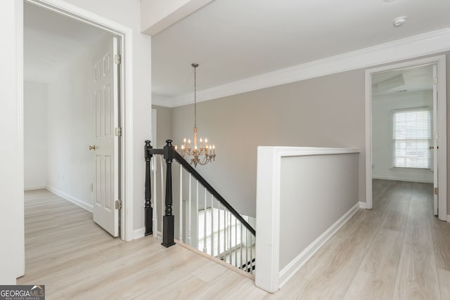2635 Stonehill Dr, Cumming, GA 30041 - corridor featuring an upstairs landing, a notable chandelier, baseboards, and wood finished floors