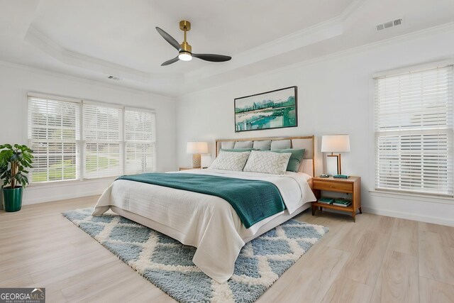 2635 Stonehill Dr, Cumming, GA 30041 - bedroom with baseboards, a raised ceiling, and wood finished floors