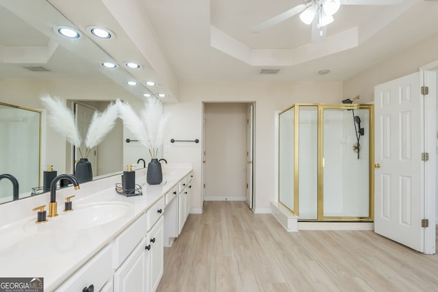 2635 Stonehill Dr, Cumming, GA 30041 - bathroom featuring recessed lighting, a ceiling fan, a shower stall, a sink, and wood finished floors