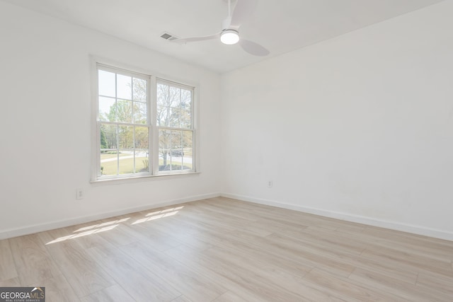 2635 Stonehill Dr, Cumming, GA 30041 - unfurnished room with light wood-style flooring, baseboards, a ceiling fan, and visible vents