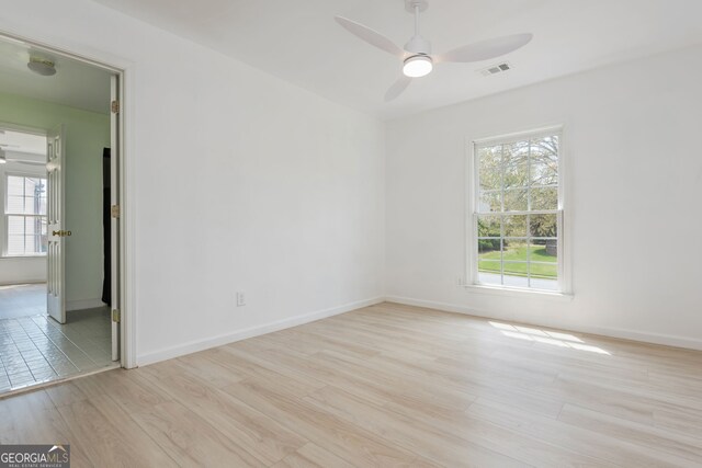 2635 Stonehill Dr, Cumming, GA 30041 - empty room featuring light wood-style flooring, baseboards, a ceiling fan, and visible vents