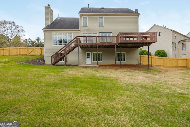 2635 Stonehill Dr, Cumming, GA 30041 - back of house featuring a yard, a fenced backyard, a deck, and stairs