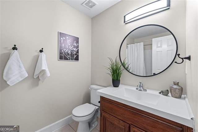 bathroom featuring vanity, baseboards, tile patterned floors, toilet, and visible vents