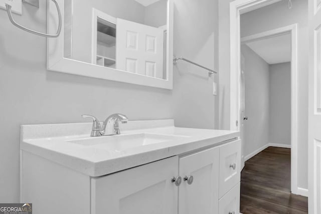 1093 Lanier Dr SW, Marietta, GA 30060 - bathroom with wood finished floors, vanity, and baseboards