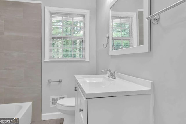 1093 Lanier Dr SW, Marietta, GA 30060 - full bathroom with visible vents, toilet, and vanity