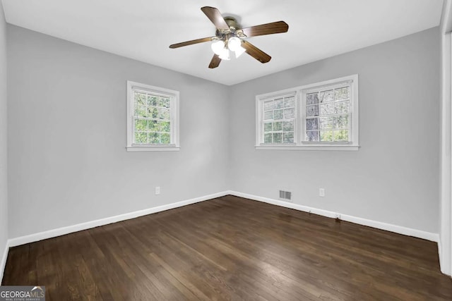 1093 Lanier Dr SW, Marietta, GA 30060 - empty room with wood finished floors, baseboards, a ceiling fan, and visible vents