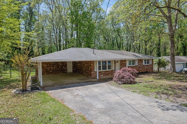 1093 Lanier Dr SW, Marietta, GA 30060 - single story home featuring fence, brick siding, a front lawn, an attached carport, and driveway