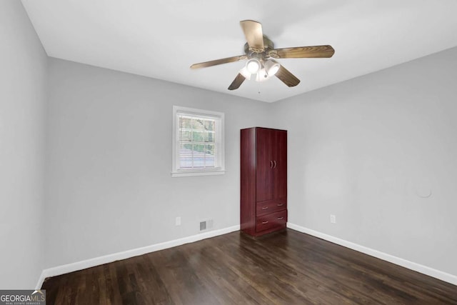 1093 Lanier Dr SW, Marietta, GA 30060 - unfurnished room featuring dark wood-style flooring, visible vents, baseboards, and a ceiling fan
