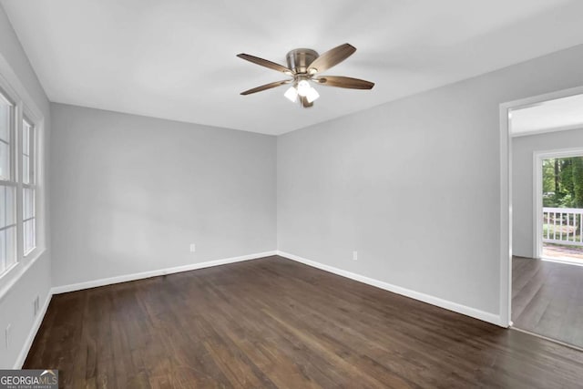 1093 Lanier Dr SW, Marietta, GA 30060 - spare room with dark wood-style floors, baseboards, and a ceiling fan