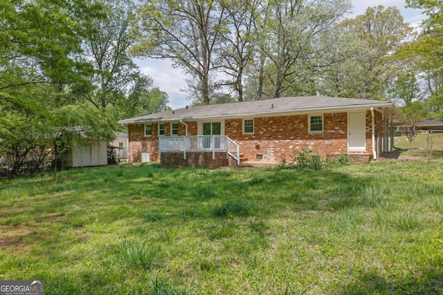 1093 Lanier Dr SW, Marietta, GA 30060 - rear view of house featuring brick siding, fence, and a lawn