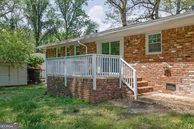 1093 Lanier Dr SW, Marietta, GA 30060 - back of property with an outbuilding, a shed, and brick siding