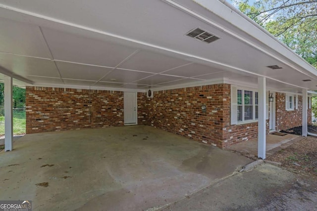 1093 Lanier Dr SW, Marietta, GA 30060 - view of patio / terrace featuring an attached carport and visible vents