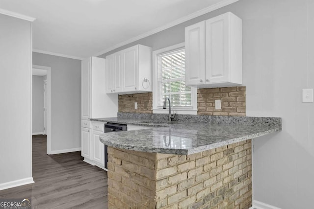 1093 Lanier Dr SW, Marietta, GA 30060 - kitchen featuring white cabinets, baseboards, a sink, dishwashing machine, and light stone counters