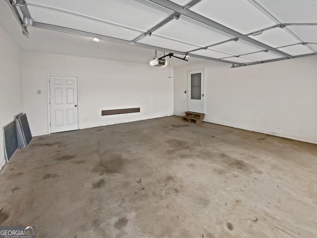 823 New Hope Rd, Mcdonough, GA 30252 - garage featuring a garage door opener