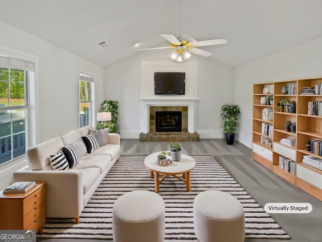 823 New Hope Rd, Mcdonough, GA 30252 - living room with baseboards, a ceiling fan, a fireplace, carpet floors, and vaulted ceiling