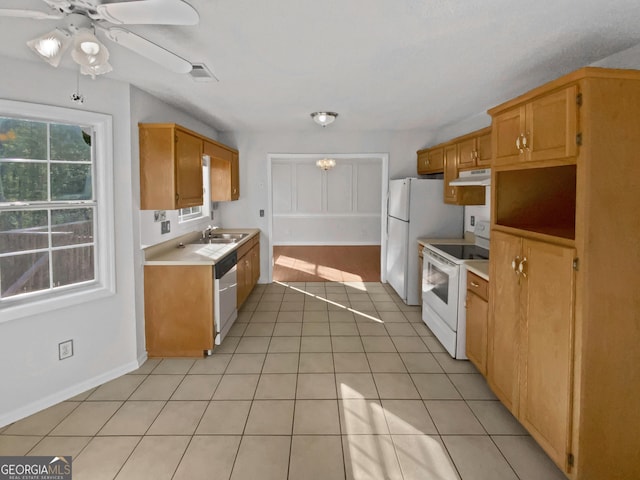 823 New Hope Rd, Mcdonough, GA 30252 - kitchen featuring white appliances, light countertops, light tile patterned flooring, ceiling fan, and a sink