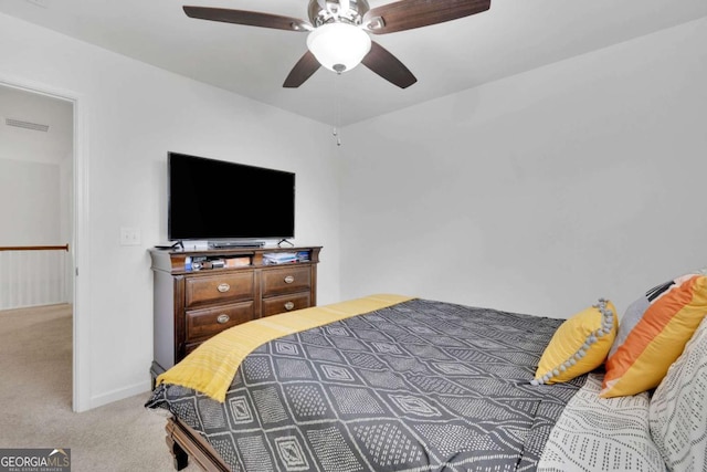 bedroom featuring a ceiling fan and light carpet