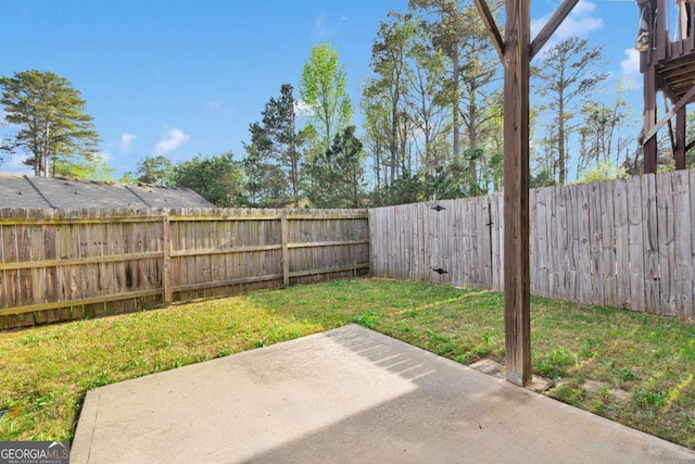 view of yard with a fenced backyard and a patio