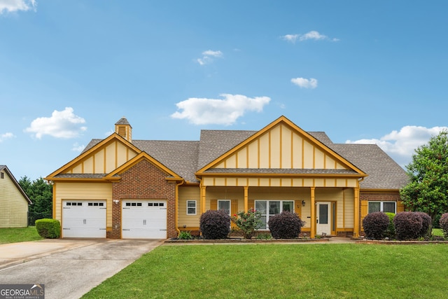 view of front of home featuring board and batten siding, a shingled roof, a front yard, and a garage