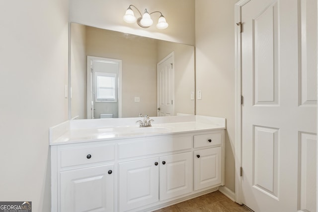bathroom with vanity and tile patterned flooring