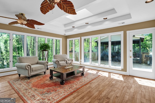 sunroom with a skylight, french doors, visible vents, and a wealth of natural light