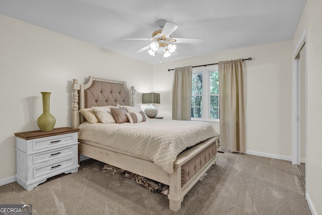 bedroom featuring baseboards, a ceiling fan, and carpet