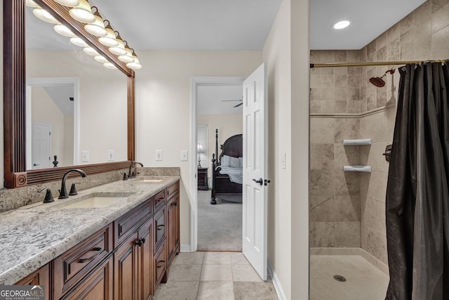 bathroom with a sink, double vanity, ensuite bath, and tiled shower