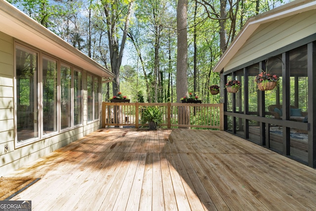 deck with a sunroom