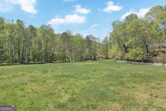 view of yard featuring a view of trees