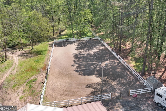 aerial view featuring a wooded view