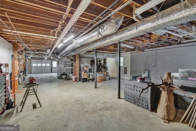 unfinished below grade area featuring concrete block wall