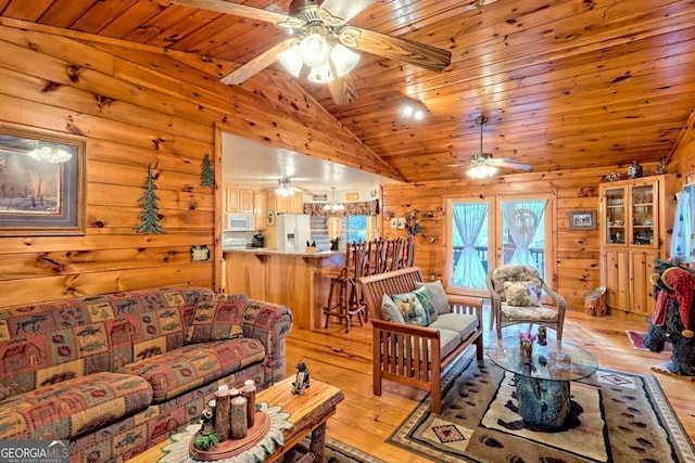 living room with light wood-style flooring, a ceiling fan, vaulted ceiling, and wood ceiling