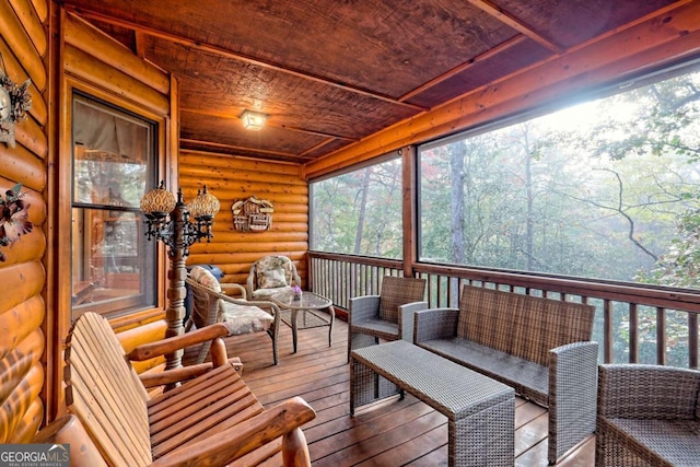 sunroom / solarium featuring outdoor lounge area