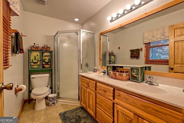 full bath with a shower stall, tile patterned floors, and a sink