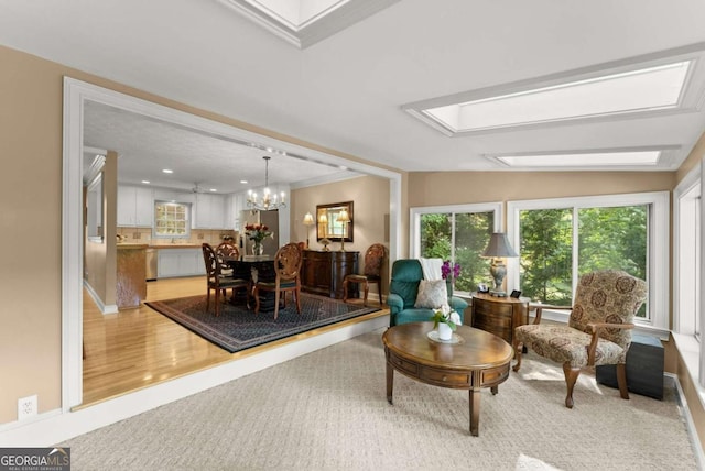 interior space featuring light carpet, recessed lighting, crown molding, and a chandelier