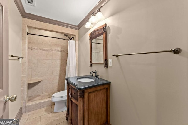 bathroom with vanity, tile patterned floors, crown molding, toilet, and a tile shower