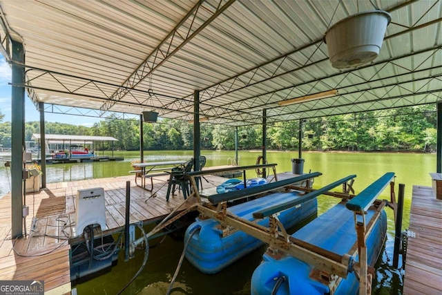 dock area featuring a water view and boat lift