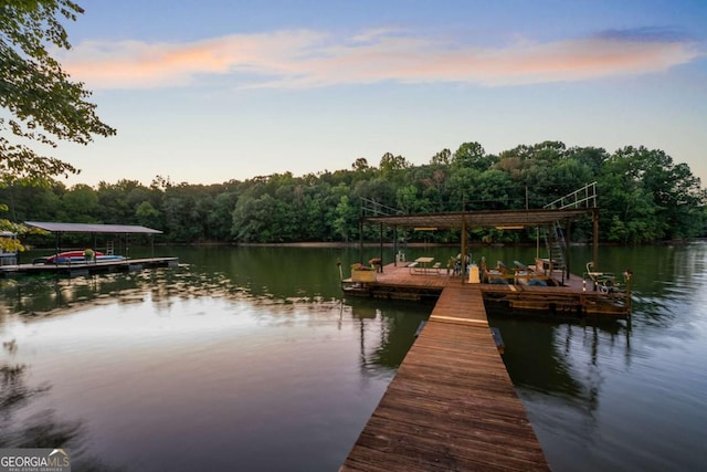 view of dock featuring a water view and a view of trees