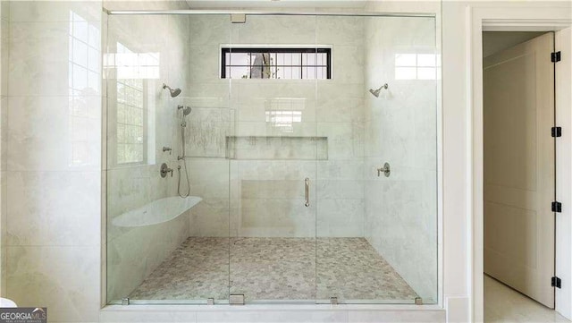 bathroom featuring a shower stall