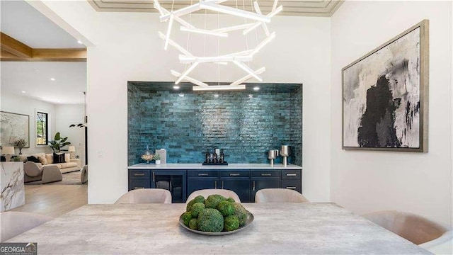 bar featuring tasteful backsplash and wood finished floors