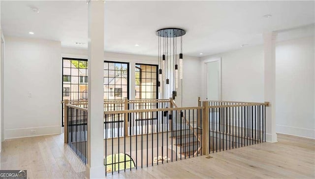 interior space featuring baseboards, recessed lighting, and wood finished floors