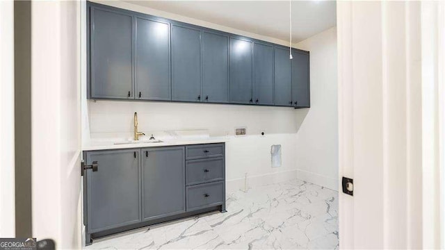 laundry room with washer hookup, a sink, cabinet space, electric dryer hookup, and marble finish floor