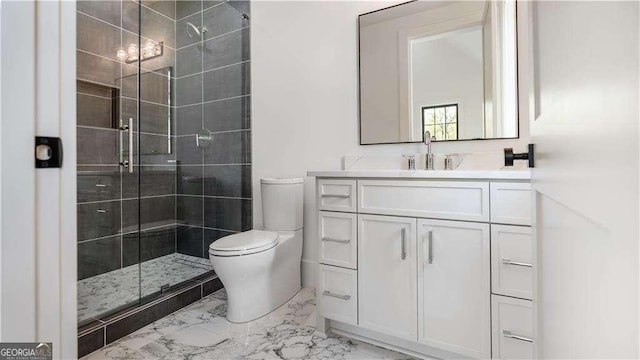 bathroom featuring a shower stall, vanity, marble finish floor, and toilet
