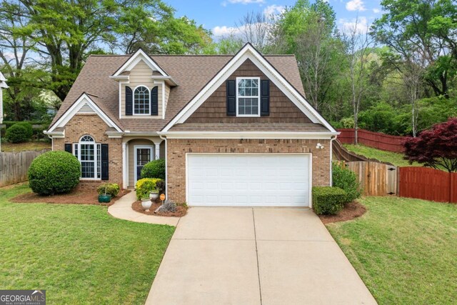 272 William Nye Dr SE, Atlanta, GA 30315 - view of front of home with brick siding, fence, and concrete driveway