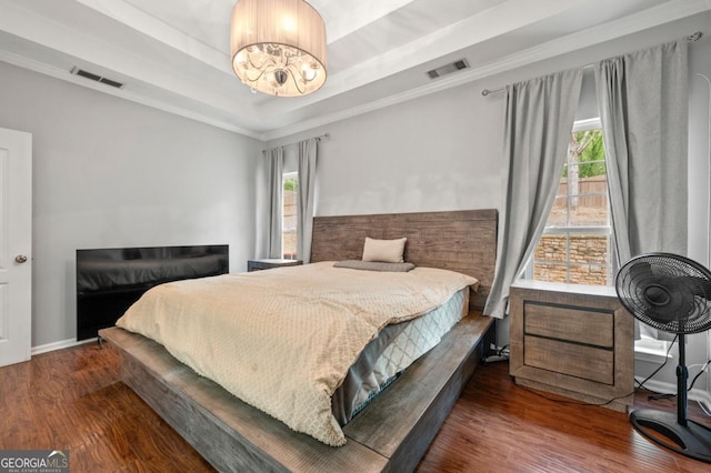 272 William Nye Dr SE, Atlanta, GA 30315 - bedroom featuring a chandelier, a raised ceiling, wood finished floors, and visible vents
