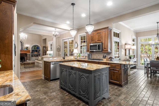 240 Trotters Rdg, Fayetteville, GA 30215 - kitchen featuring a chandelier, a peninsula, brick floor, stainless steel appliances, and a kitchen island