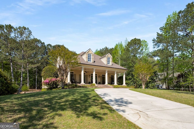 240 Trotters Rdg, Fayetteville, GA 30215 - view of front of property featuring concrete driveway, a front yard, a porch, and a ceiling fan