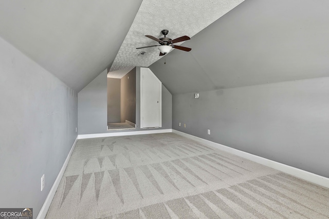 135 Fairway Ct, Newnan, GA 30265 - bonus room featuring a ceiling fan, carpet, baseboards, and lofted ceiling