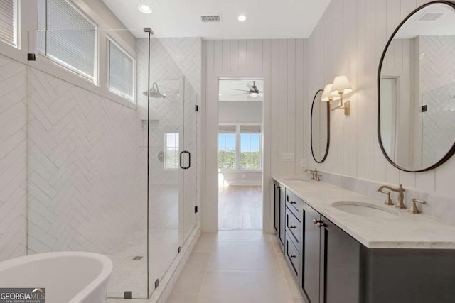 1130 Lupo Loop, Chattahoochee Hills, GA 30268 - bathroom with a shower stall, a freestanding bath, double vanity, tile patterned floors, and ceiling fan